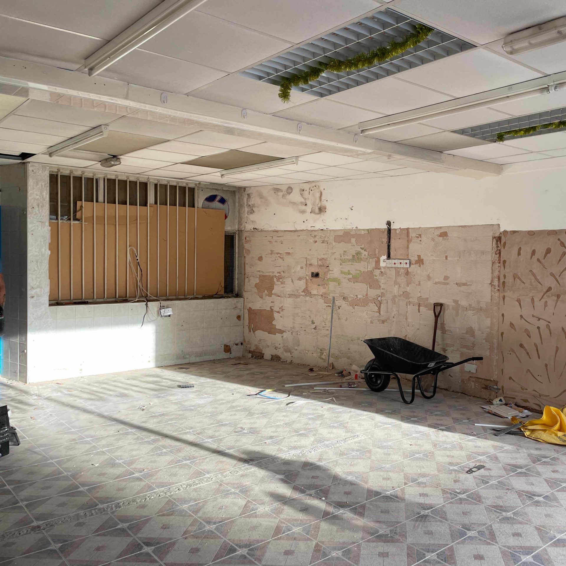 The inside of the new evoke visual studio showing an empty shell with builders equipment and unplastered walls
