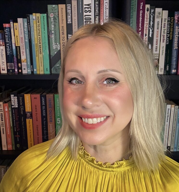 Sarah Taffe headshot in front of a bookcase