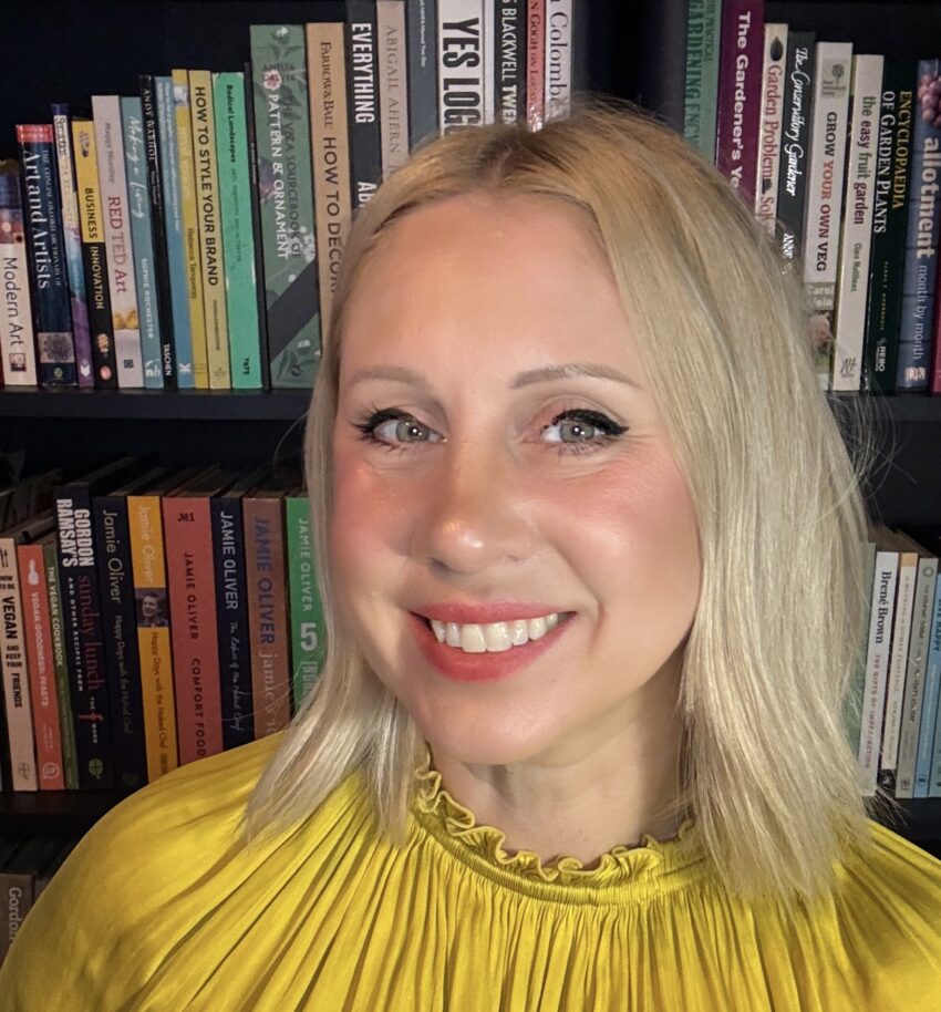 Sarah Taffe headshot in front of a bookcase
